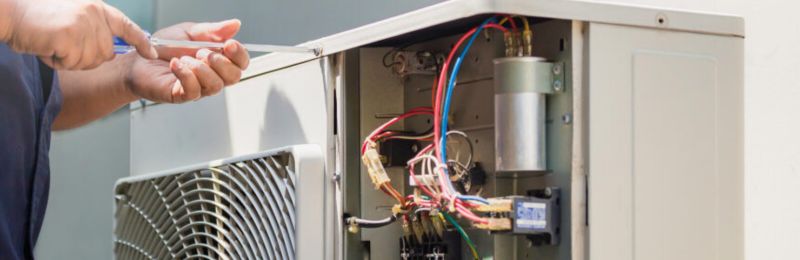Furnace technician repairing a heating system in Encinitas CA